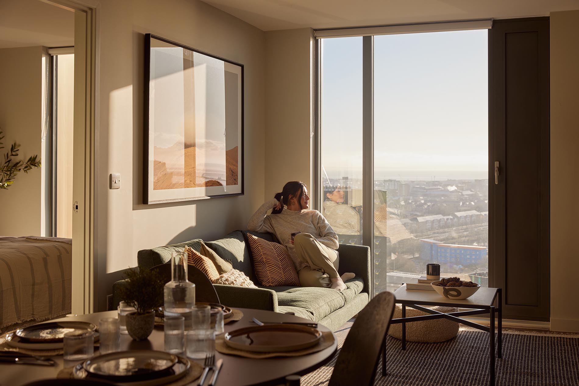 Sitting on Sofa by Window