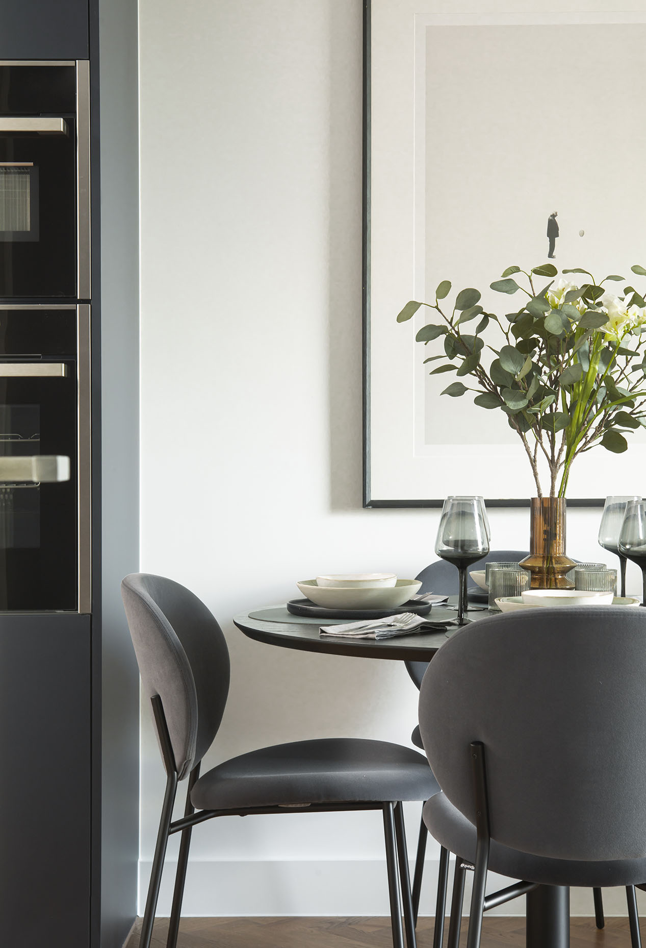 Dining table next to kitchen appliances Dining table next to kitchen appliances