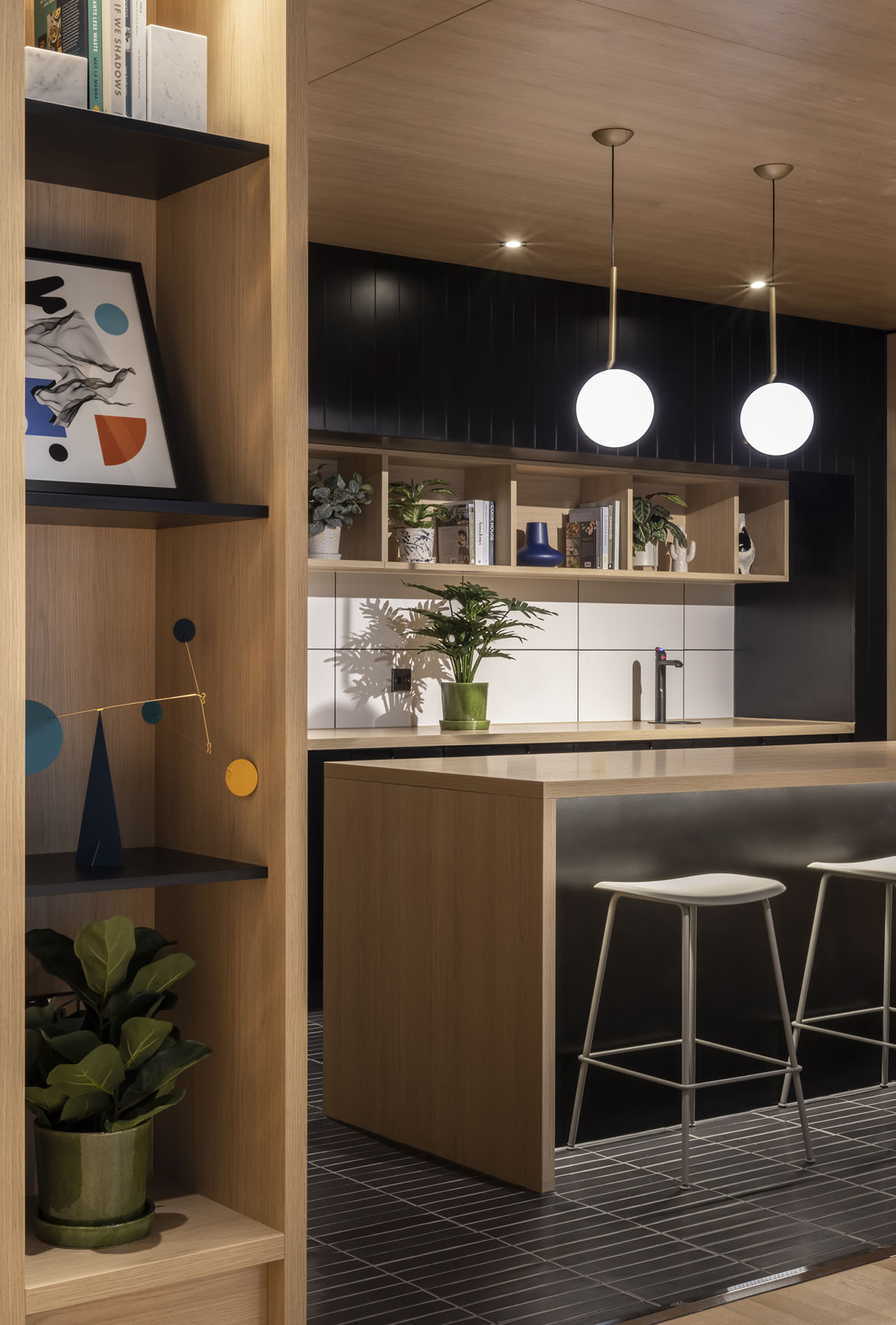 Breakfast bar area with island and stools Breakfast bar area with island and stools