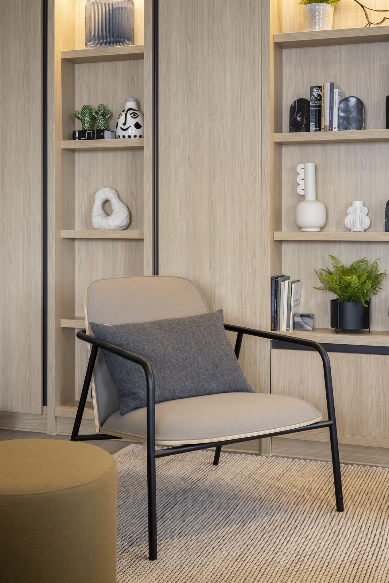 Chair with cushion by shelves Chair with cushion by shelves