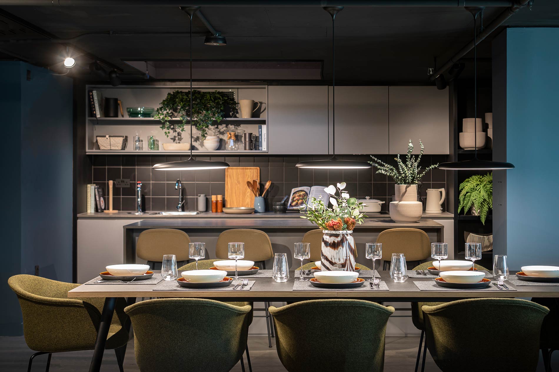 Kitchen area with table set for 8 people Kitchen area with table set for 8 people