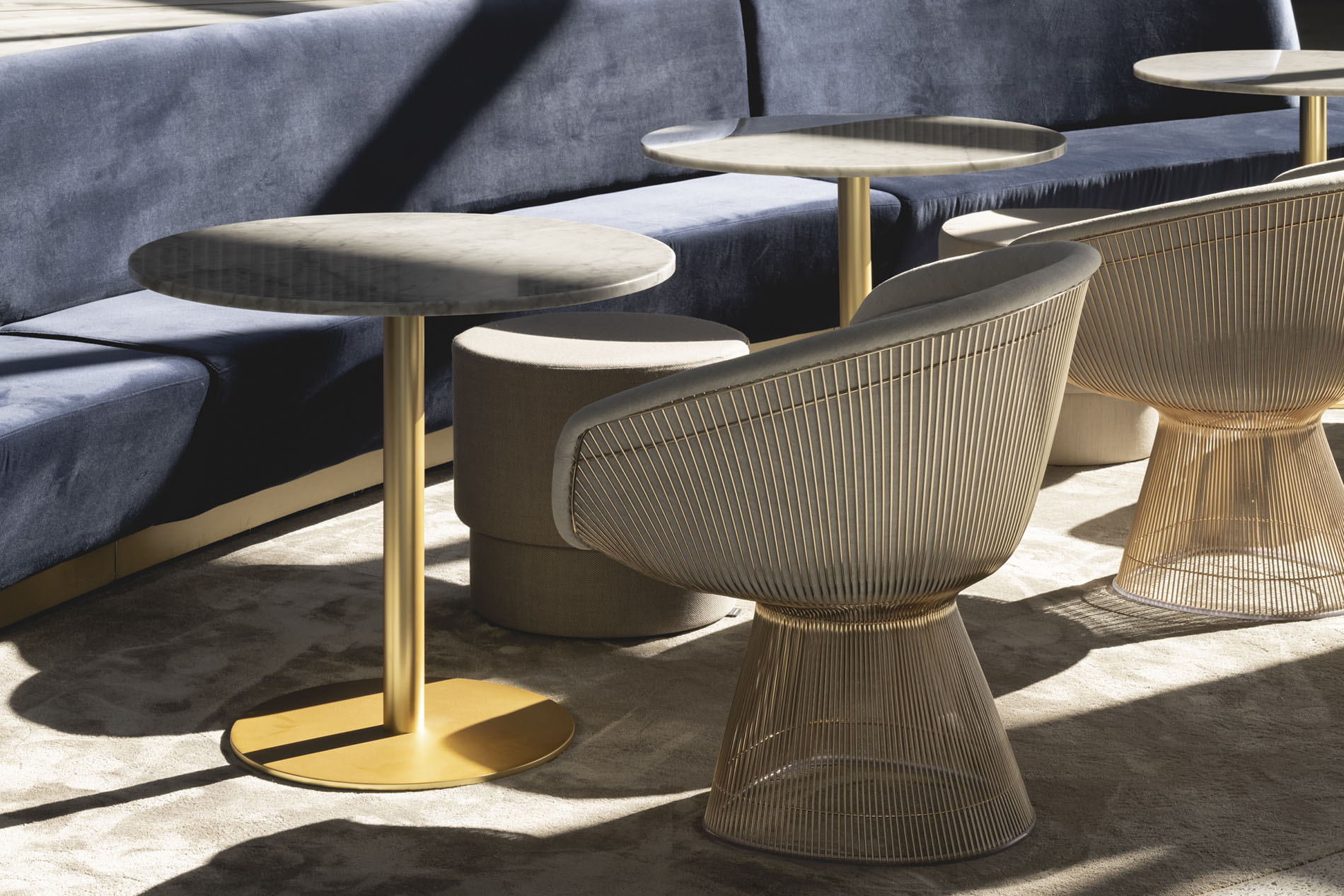 Sitting area with tables long sofa and chairs