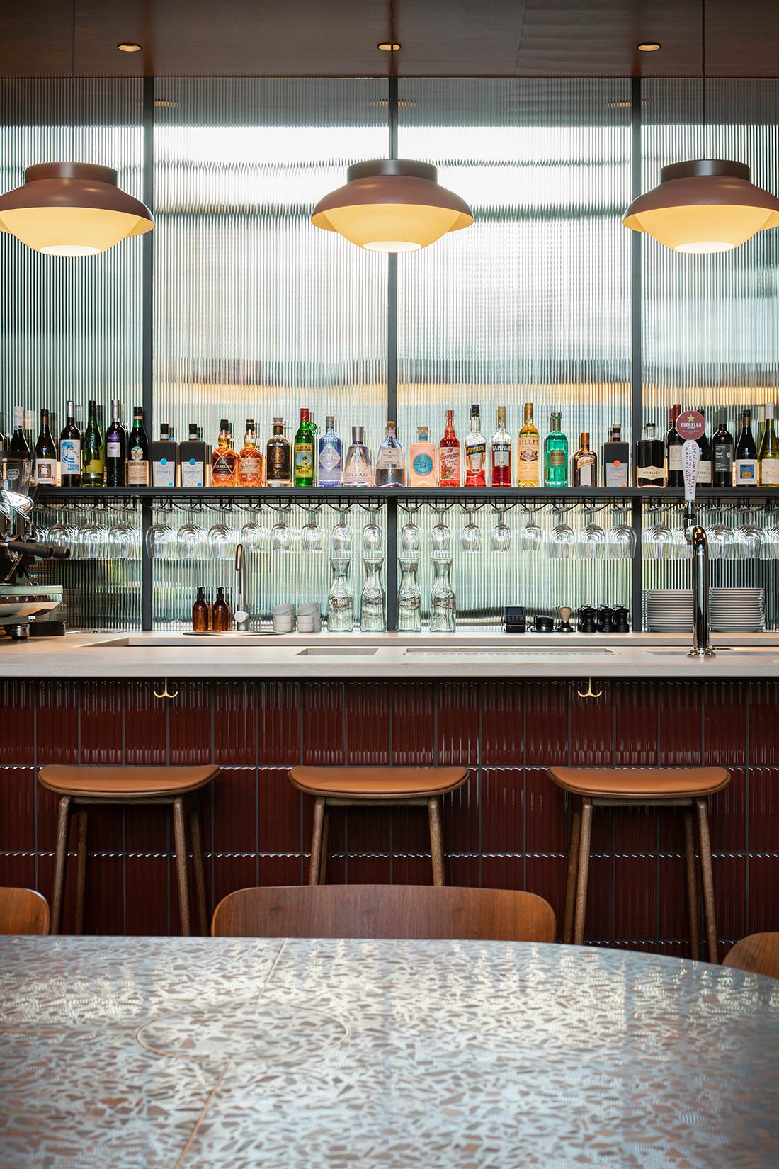 View over bar with bottles and glasses