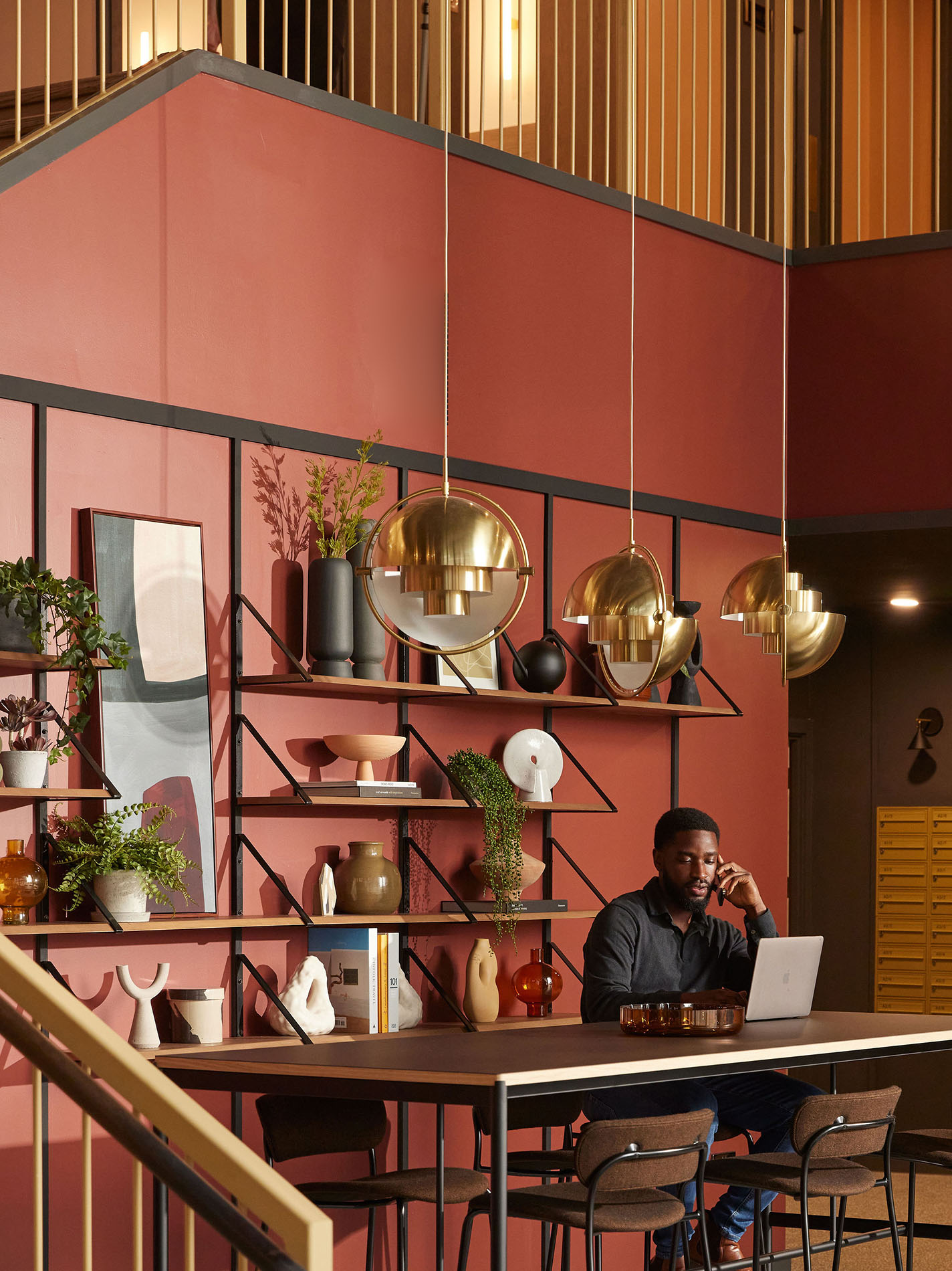 Man with laptop at large desk
