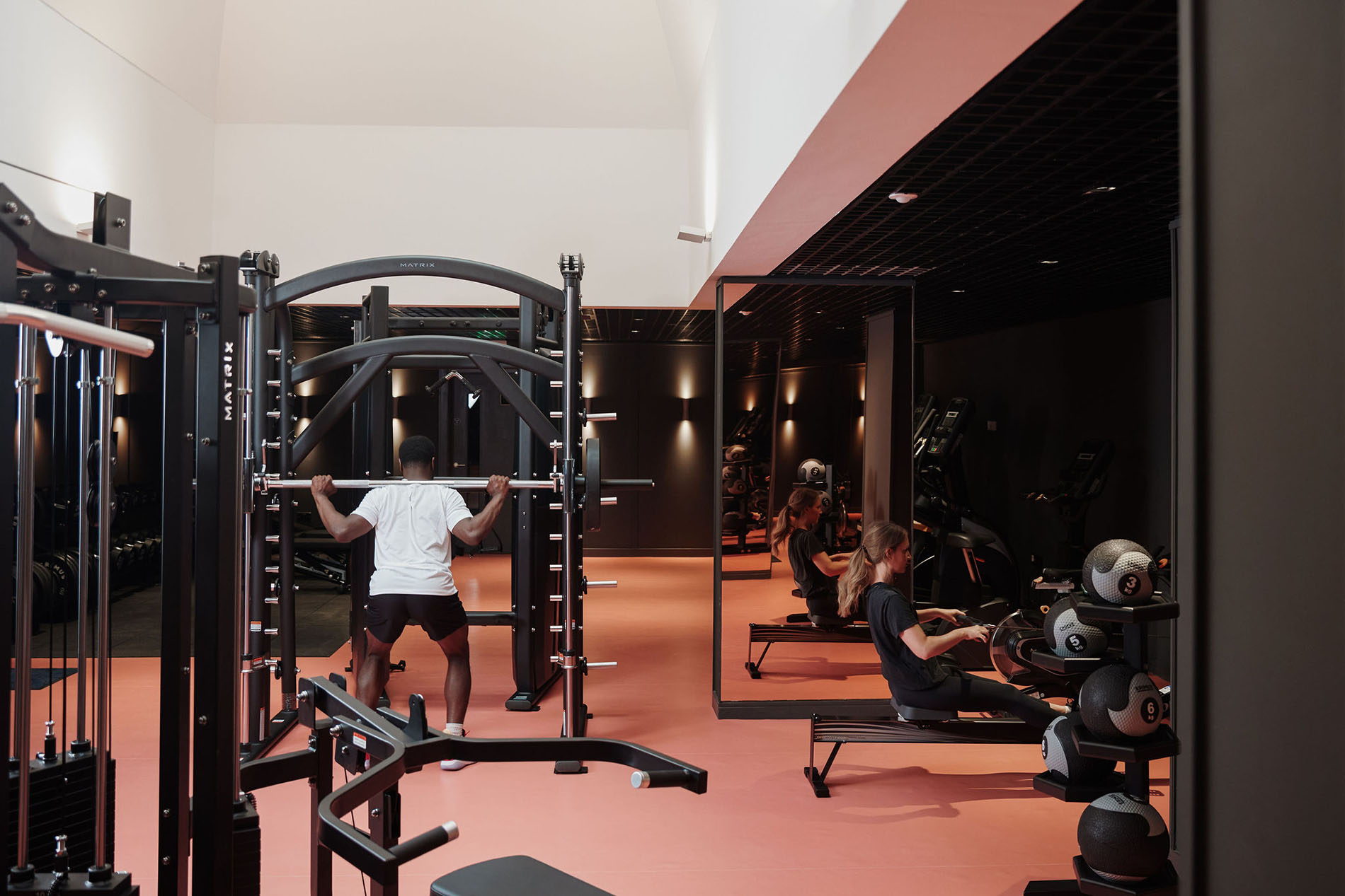 People using equipment in gym