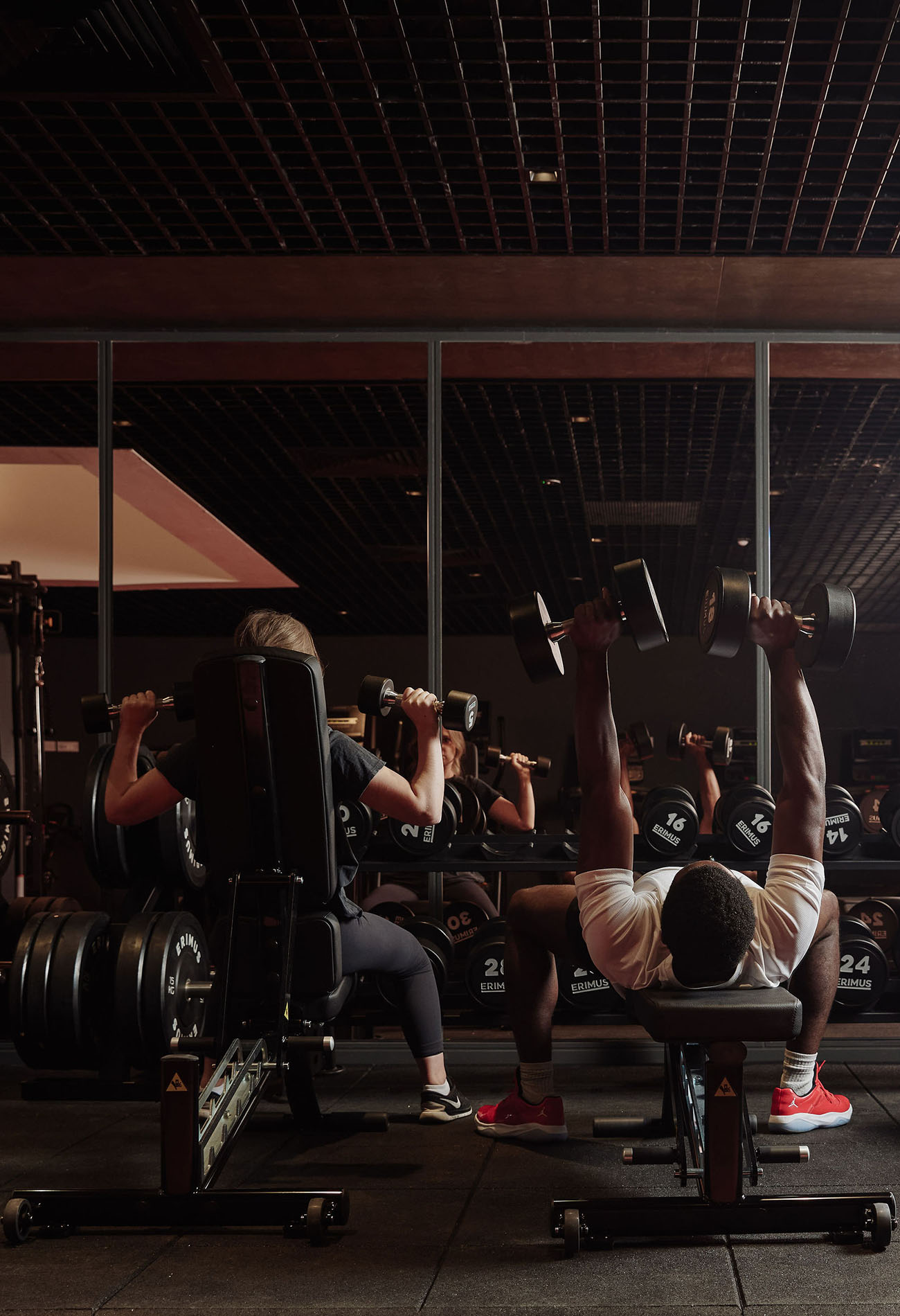 People using weights in gym