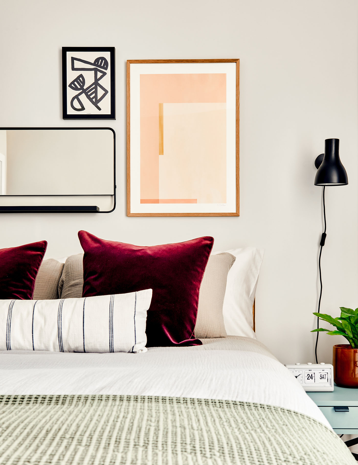 Bed accessorised with velvet cushions
