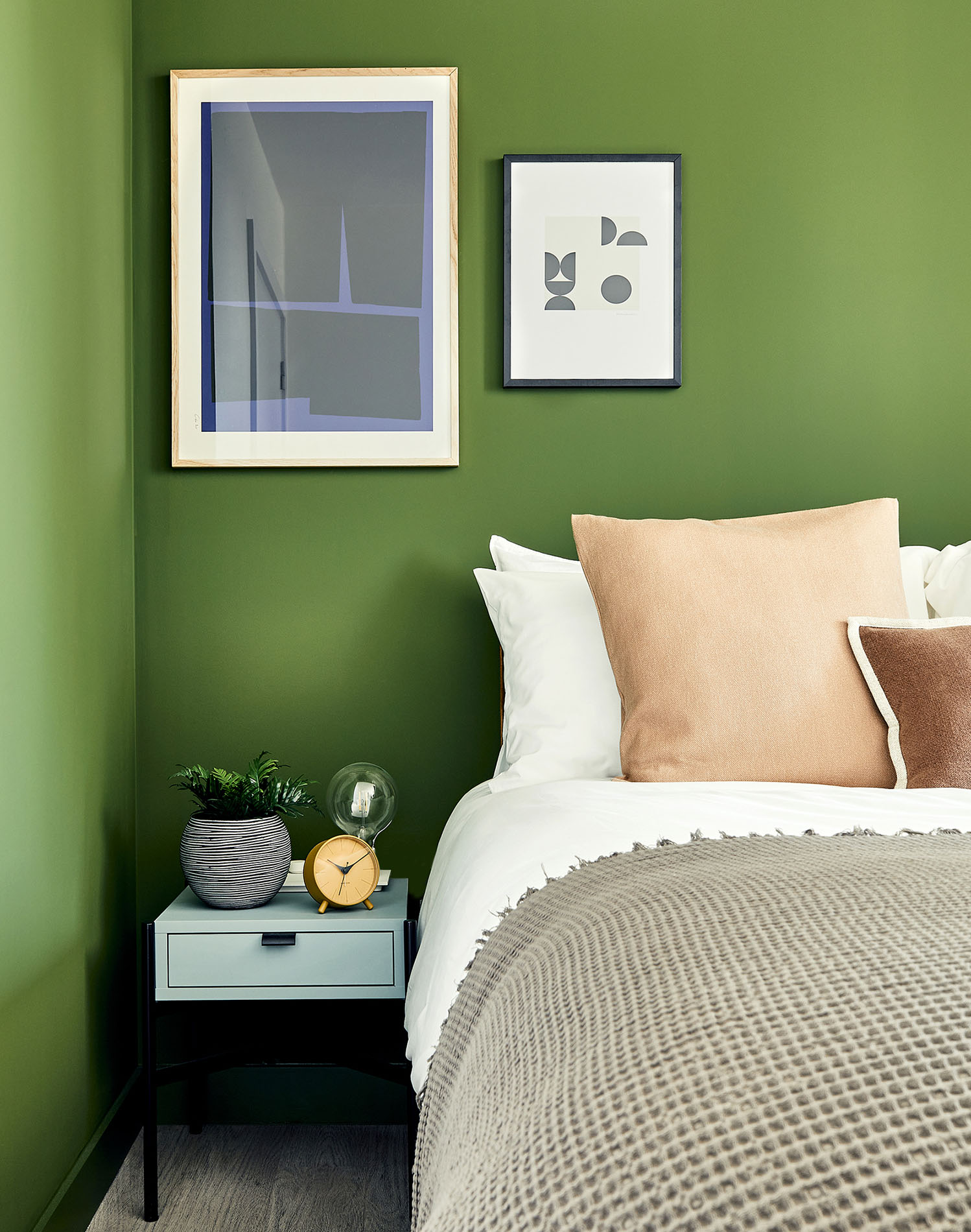 Bedside table with clock and plant